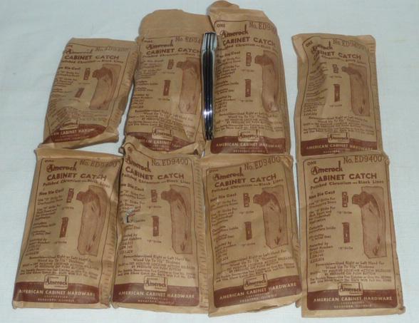 8 Vintage Amerock Deco Cabinet Catch Hardware: Fabulous Amerock Chrome Cabinet Catch Pulls. This set of eight is Pure Art Deco Period 1920-30's . Polished Chromium with Black inset Stripes. Each Pull measures 4” long. Marked A for Amerock. T