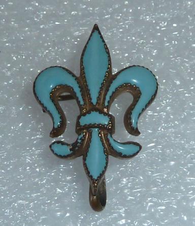 Antique Enamel Fleur De Lis Watch Chatelaine: Long considered a symbol only for royalty , the Fleur-de-lis has become a symbol of everyday luxury. This charming Chatelaine pin / watch holder will enhance any ensemble you choose to wear. Goes well