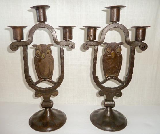 Pair Antique Goberg Wrought Iron Owl Candlesticks: Lovely three arm owl standing candelabra with a warm and soothing patina. Signed Germany on base. These are sure to impressâ€¦ Measure 13 1/2" tall by 7" wide on a 4 3/4" round base. As found esta