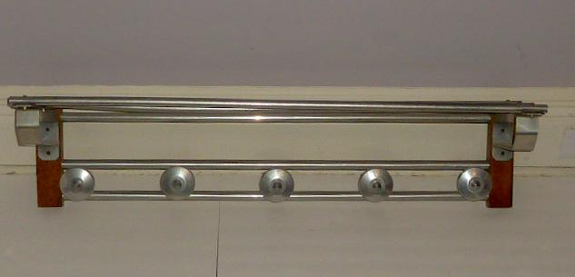 French Art Deco / MCM Aluminum Tubular Coat & Hat Rack: Four tubular rods over two tubular rods with four stylized circles on which to hang your hat and coatâ€¦ Sure to please any discerning collectorâ€¦ Measures 37 1/2" wide by 10" deep and 8 1/2"