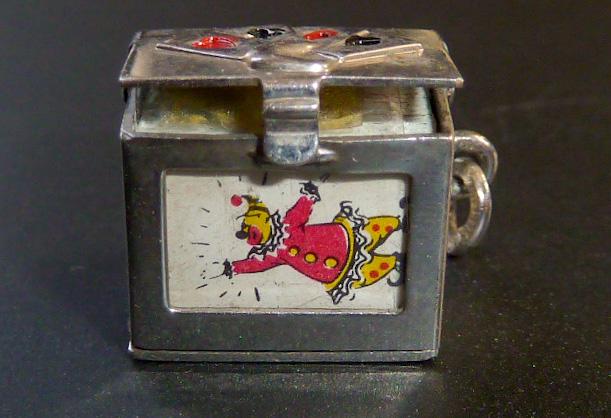Vintage Sterling Silver 3D Deck of Cards Charm: Vintage sterling silver deck of cards charm. This enameled charm top show the four Aces and holds a miniature deck of cards with the incredible Joker card as front card, visible through the opening. H