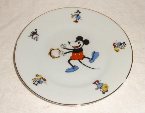 1928-30 Bavaria China Mickey Mouse Plate: Seldom see in this condition , from Bavaria with Mickey Mouse Trade Mark on back , plate shows Mickey playing the tamborine with smaller figures of Mickey and Minnie and Felix on border of plate what