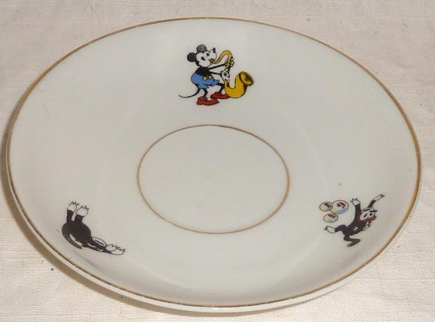 1928-30 Bavaria China Minne Mouse Plate: seldom see in this condition , from Bavaria with Minnie sitting in a rocking chair holding two Mickeys and rocking with her foot another Mickey in a cradleâ€¦ Mickey , Felix , are on the border of