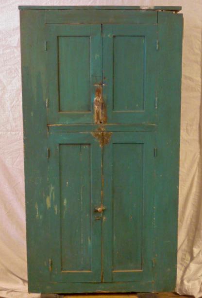 American Green Four Door Paneled Cupboard: Untouched from a Middburg New York farm house. Green four door paneled corner cupboard. Hand hewn back. Original hardware, wonderful worn patina, Measures 38" wide by 71" tall and 21" deep . As found 
