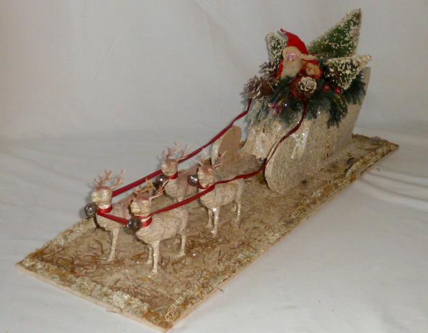 Antique Christmas Dispaly Santa in Sleigh 27 â€ with: Antique Early Christmas Holiday Santa in his sleigh with Reindeer . This piece is fabulous. Measures 27” on its base . Sleigh is wood measuring 13 ½” long by 6” high by 4 â��