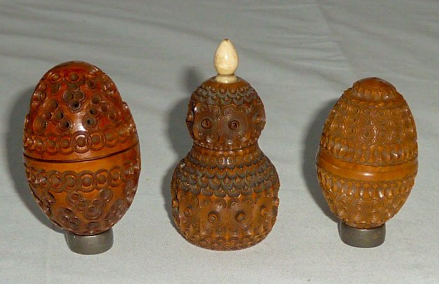 Three Antique Wood Carved Scent Vessels: Lot of Three Carved Victorian Pomander boxes . All three are Beautifully Carved from wood and screw top to bottom , first measures 3" long by 1 1/2" and is pear shaped vanity piece for perfume scents 