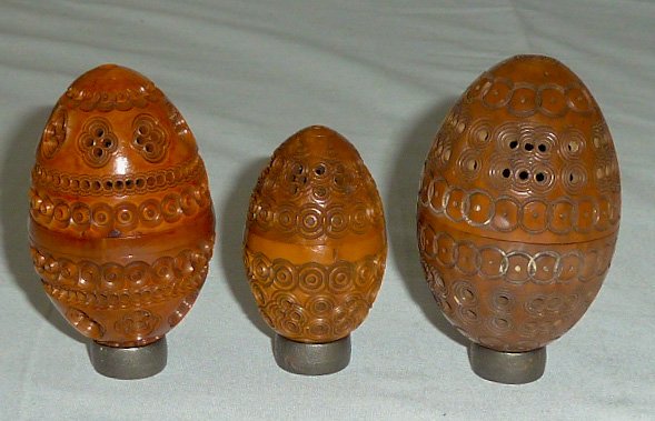 3 Intricately Carved Victorian Era Pierced Pomanders: Lot of Three Carved Victorian Egg Shaped Pomanders Boxes . All three are Beautifully Carved from Coquilla wood and screw top to bottom , Largest measures 3" tall by 1 3/4" circumference. Second Victor
