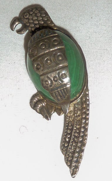 Sterling Silver and Malachite Parrot Pin: This darling parrot sterling silver and malachite pin is signed 925 made in Mexico. I see no Damage or repairs. Measures 2 3/4" tall and 1" wide and 3/8" deep. Has the clasp/pin on back and opens and