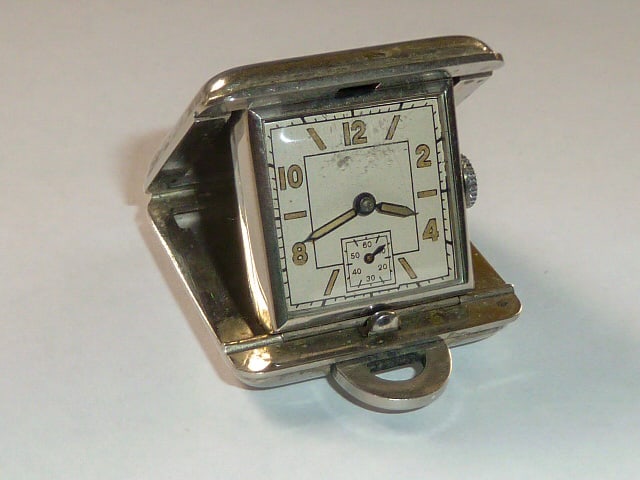 Ebel Early Mini Travel Watch: EBEL early mini-travel-watch, Switzerland around 1930, manual winding, open up case, original dial with Arabic luminous numerals, original luminous hands, signed lever movement with screw- balance, me