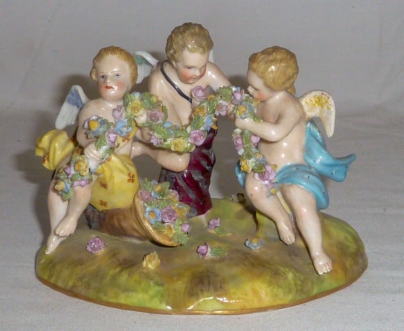 Antique Meissen Putti Group / Cornucopia - 3 Angels/Cherubs Gathering Flowers/Garland from a: Lovely Meissen Putti grouping of three angels gathering flowers from a cornucopia and making a garland . Represents Spring/Summerâ€¦ Very fine hand painted detail throughout the grouping. Marked o