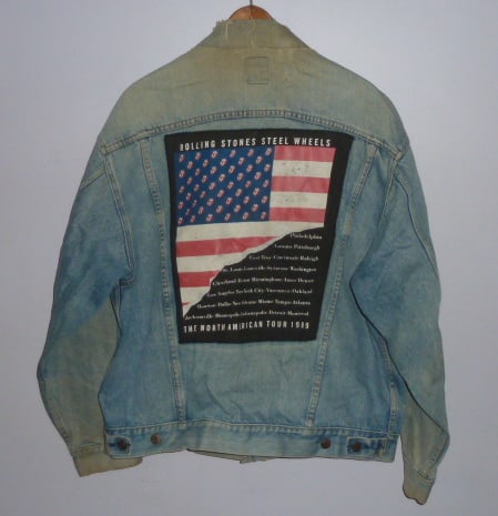 Rolling Stones 1989 Steel Wheels Tour Official Denim Jacket - Embroidered Tongue - Brockum Label: This 1989 Rolling Stones ldenim jacket was official swag from the tour. Not in mint condition, well worn, collar has split ( see photos) with some small stains, has the Rockwave by Brockum label. Miss