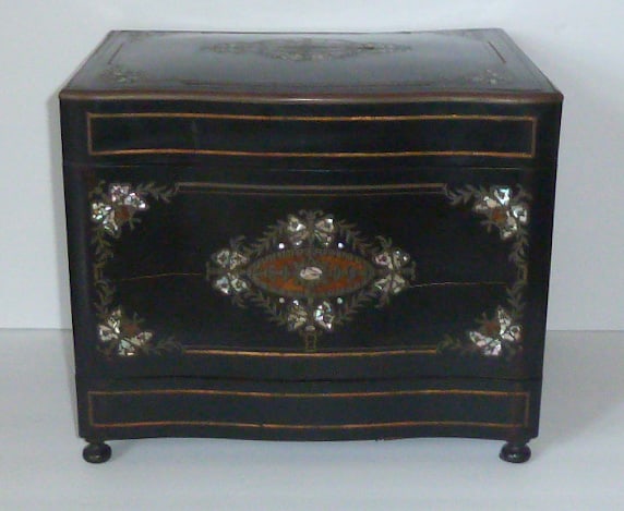 Antique Ebony Tantalus/Cabinet with Inlaid Boulle' & Mother of Pearl Butterflies: Lacquer tantalus/decantor liqueur cabinet decorated on the exterior with mother of pearl butterfly cartouches in boulle' workmanship. Raised on small footed base. One piece of brass inlay is missing (