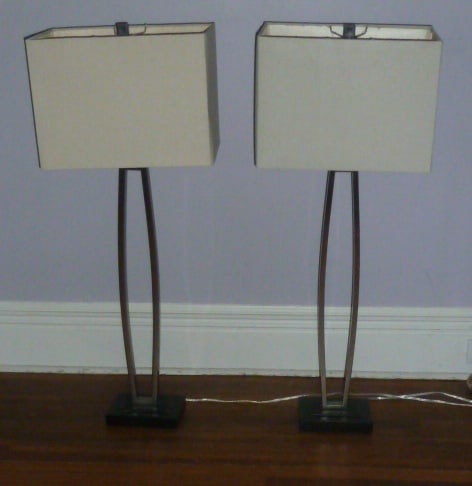 Pair Mid-Century Modern Style Lamps w/ Original Shades: Showing a pair of chrome and black base, large, mid-century modern style lamps. The lamps measure38" tall on a 7 1/8" by 5 1/4" and 1 1/4" high base. Shades measure 15" by 11" and 9 3/4" tall. Shades 