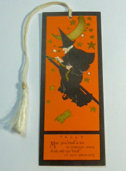 1920's Halloween Tally Card - Flying Witch & Bat: This 1920's Halloween Tally Card shows a Witch flying through the starry moonlit night . This card measures 5” by 2” with Tassel . Color is beautiful with gilt gold color stars, moon and a