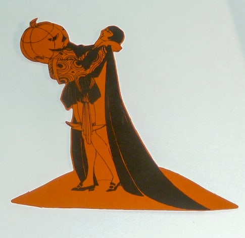 Vintage Figural Buzza Co. Halloween Place Card - Man Reveler Holding Jack-O-Lantern: 1930's Halloween Figurative Place Card . Figural card shows a male reveler in Halloween costume holding up a Jack-O-Lantern . Cards are elaborately done and are cut-outs of a deep rich black on orange