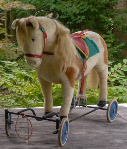 Vintage Steiff Riding Pinto Pony/Horse On Wheels: Circa 1950's, wonderful Steiff pony on wheels . The riding horse is all original: saddle blanket, saddle, bridle . The pony has a pull ring to make it whinny, it's still working. Has the steering bar.