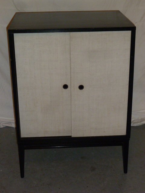 PAUL McCOBB PLANNER GROUP CABINET: SHOWING A VINTAGE PAUL Mc COBB CABINET MADE BY THE PLANNER GROUP, WINCHENDOWN FURNITURE CO. ,WINCHENDOWN MA. LABEL ON BACK.HAS WHITE SLIDING DOORS AND BLACK EXTERIOR , 24" X 38" X 18". EXCELLENT AS FO