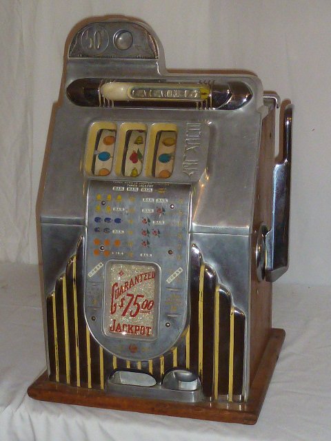 1930'S BUCKLEY CRISS CROSS 50 CENT SLOT MACHINE: SHOWING A 1930'S ART DECO THREE WHEEL,BUCKLEY CRISS CROSS ,50 CENT SLOT MACHINE. AS FOUND ESTATE CONDITION.PLEASE USE PHOTOS AS PART OF THE DESCRIPTION. THE ABSENCE OF A CONDITION REPORT DOES NOT GUAR