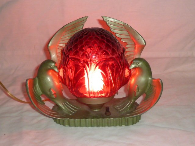 ART DECO DOUBLE DOVE LAMP FRANKART: SHOWING A MAGNIFICENT ART DECO TABLE LAMP : TWO DOVES WITH A RED EMBOSSED SHADE IN THE MANNER OF FRANKART. SIGNED NO.87 ON BACK OF LAMP .PLEASE USE PHOTOS AS PART OF THE DESCRIPTION. THE ABSENCE OF A