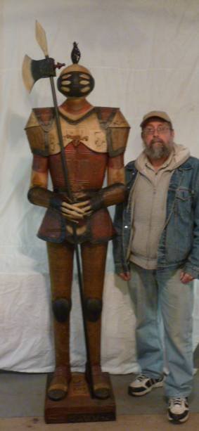 METAL FIGURAL KNIGHT IN ARMOR 8FT.: SHOWING A KNIGHT IN ARMOR EIGHT FOOT TALL MADE OF FAUX LICENSE PLATES . PLEASE USE PHOTOS AS PART OF THE DESCRIPTION. THE ABSENCE OF A CONDITION REPORT DOES NOT GUARANTEE EXCELLENT CONDITION.PLEASE CO