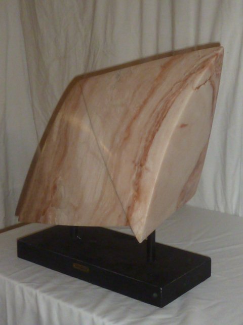 EMILE GILIOLI ABSTRACT MARBLE SCULPTURE: SHOWING A EMILE GILIOLI ABSTRACT MARBLE SCULPTURE . MEASURES 18 1/2" BY 9" BY 12" . SMALL ROUGH SPOT AT ONE TIP . SIGNED ON PLAQUE . LABEL SHOWING PROVENANCE: WALT SIMON AS FOUND ESTATE CONDITION.PLEA