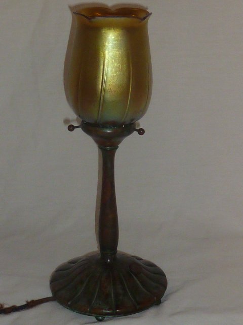 TIFFANY STUDIOS BOUDOIR ACCENT LAMP: SHOWING A SIGNED TIFFANY STUDIOS BOUDOIR ACCENT LAMP/LITE BASE WITH ART GLASS SHADE . PLEASE USE PHOTOS AS PART OF THE DESCRIPTION. THE ABSENCE OF A CONDITION REPORT DOES NOT GUARANTEE EXCELLENT CONDI