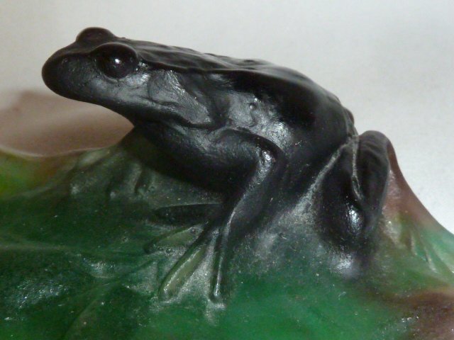 DAUM, NANCY ART GLASS FROG ON LILY PAD: SHOWING A SIGNED DAUM, NANCY .PATE DE VERRE GLASS ,FROG ON A LILY PAD . SIGNED ON THE BOTTOM OF THE MULTI COLOR ART GLASS FROG. PLEASE USE PHOTOS AS PART OF THE DESCRIPTION. THE ABSENCE OF A CONDITION