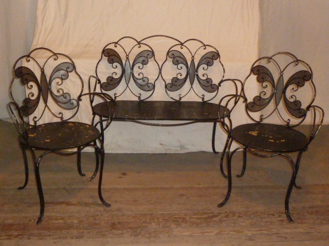 1930'S IRON 3 PIECE GARDEN SET BUTTERFLY MOTIF: SHOWING A THREE PIECE IRON GARDEN SET FROM THE 1930'S . THIS DISTINCTIVE GARDEN SET HAS A SETTEE AND TWO MATCHING CHAIRS ALL WITH A BUTTERFLY MOTIF ON THE BACK OF CHAIRS. PIERCED SEATS AND SHAPED ARMS