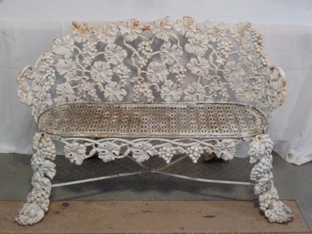 1870'S CAST IRON AMERICAN BENCH JOHN McLEAN MAKER: SHOWING A VICTORIAN CAST IRON AMERICAN BENCH IN THE GRAPEVINE PATTERN ,FOUNDRY MARK JOHN McLEAN NY . BARREL -FORM BACK , RETICULATED SEAT , OUTWEPT LEGS .ONE OF TWO IN SALE . MEASURES 31" HIGH 44" WID