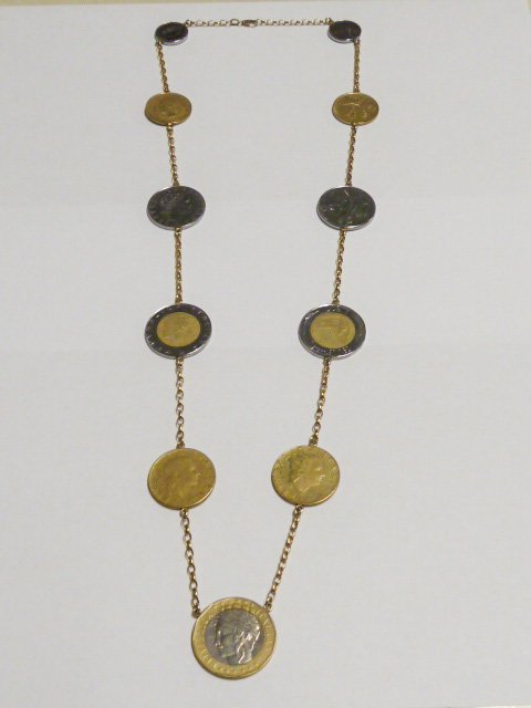 COIN NECKLACE WITH 14KT CHAIN: SHOWING A COIN NECKLACE WITH A 14KT GOLD CHAIN CONNECTING THE COINS. AS FOUND ESTATE CONDITION.PLEASE USE PHOTOS AS PART OF THE DESCRIPTION. THE ABSENCE OF A CONDITION REPORT DOES NOT GUARANTEE EXCELL