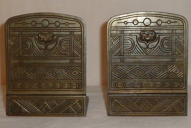 TIFFANY STUDIOS AMERICAN INDIAN PATTERN BOOKENDS: SHOWING A TIFFANY STUDIOS NEW YORK 1198 SET OF BRONZE BOOKENDS IN THE "AMERICAN INDIAN" PATTERN .SECOND OF THREE TIFFANY "AMERICAN INDIAN" PIECES IN THIS SALE.MEASURES 6" TALL BY 4" WIDE AND 5" DEEP. 