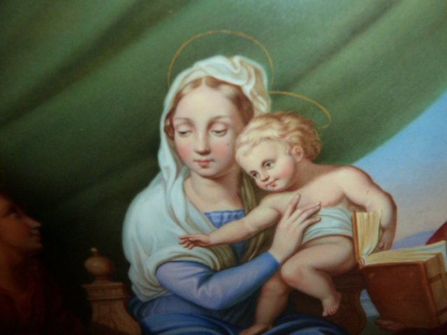 MEISSEN PORCELAIN PLAQUE MARY JESUS SAINTS: SHOWING A FRAMED MEISSEN PORCELAIN PLAQUE OF MARY AND JESUS WITH ST. PETER ANGELS AND A SITTING LION. BACK HAS THE CROSSED MEISSEN SWORDS , AN INCISED NUMBER AND MARK .SIGNED IN PENCIL E.M. 1949 . POR