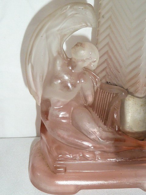 PAIR OF ART DECO ANGEL CAMPHOR GLASS ACCENT LIGHTS: SHOWING A PAIR OF PINK AND WHITE ART DECO ANGEL CAMPHOR GLASS ACCENT LIGHTS. MEASURE 11" TALL ON A 3" BY 5" BASE. AS FOUND ESTATE CONDITION.PLEASE USE PHOTOS AS PART OF THE DESCRIPTION. THE ABSENCE OF