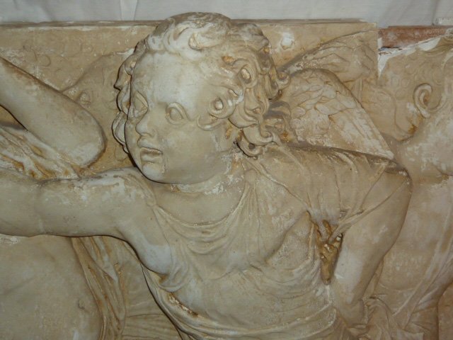 2 VINTAGE PLASTER FRIEZES 10 WINGED ANGELS: SHOWING TWO VINTAGE PLASTER FRIEZES WITH TEN FROLICKING WINGED ANGELS. THE TWO PIECES CONNECT AND MEASURE EIGHT FEET OVERALL. ONE PANEL MEASURES 52" LONG THE OTHER 44" LONG. BOTH ARE 37" HIGH AND 7" D