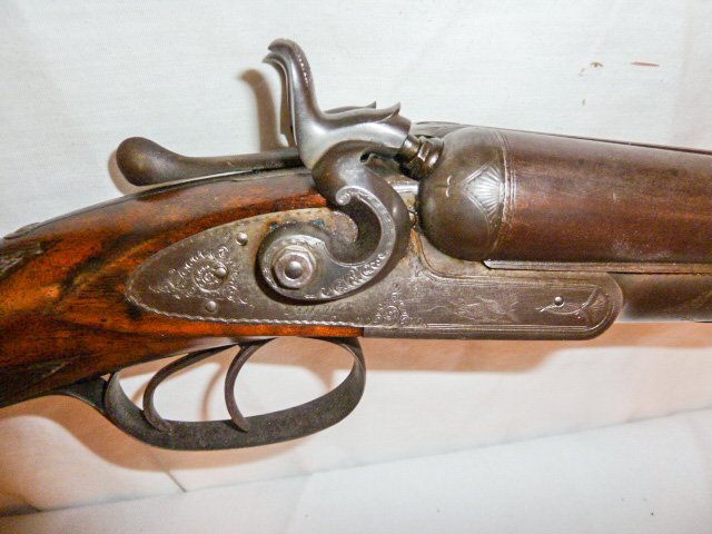 1878 COLT 12 GAUGE DOUBLE BARREL SHOTGUN DAMASK: SHOWING A 1878 COLT 12 GAUGE DOUBLE BARREL SHOTGUN WITH DAMASCUS BARREL , ENGRAVING OF BIRDS AND POINTER DOGS .FULL LENGTH IS 46 1/2" ,BARREL MEASURES 30 3/4" LONG . AS FOUND ESTATE CONDITION.PLEASE U