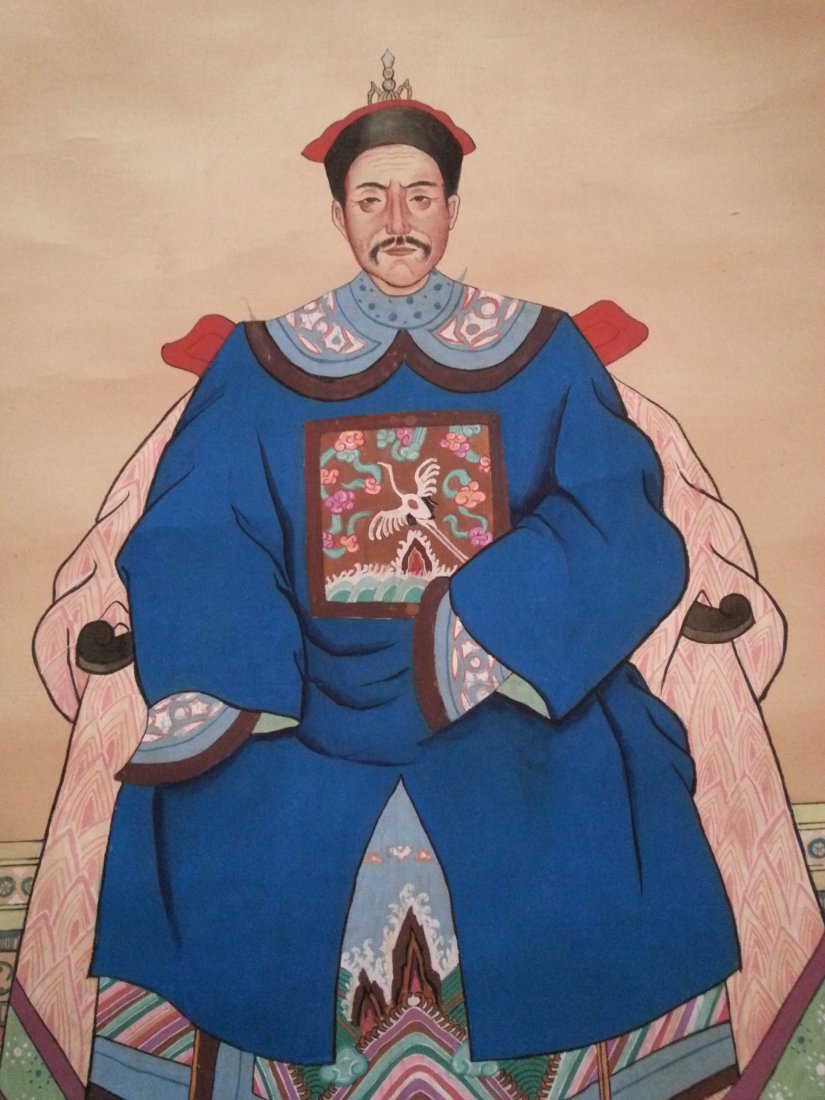 Chinese ancestral portraits: Pair of 20th c. Chinese ancestral portraits on silk and paper of the Zhang family. Depicts a couple in Manchurian court clothing.