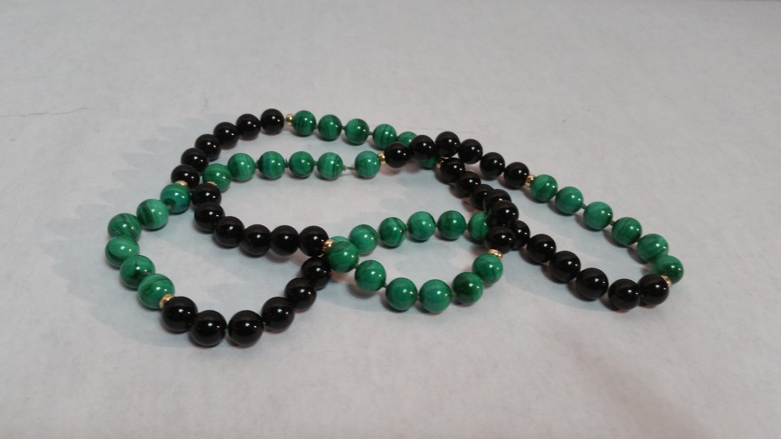 Vintage malachite and onyx bead necklace: Vintage malachite and onyx bead necklace with 14k gold spaces.