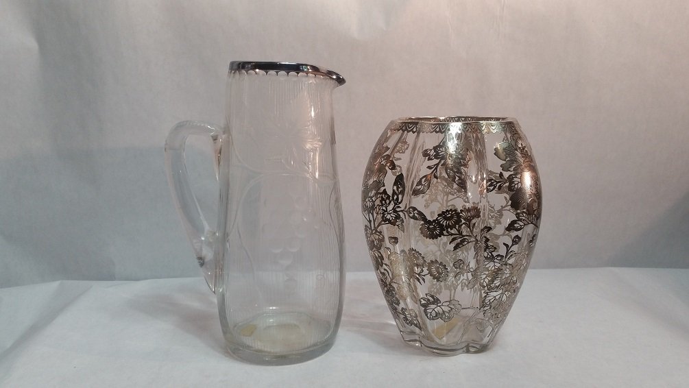 2 Piece Crystal Sterling overlay: Lot consisting of cut crystal pitcher with sterling rim and crystal vase with sterling overlay in the design of floral foliage.