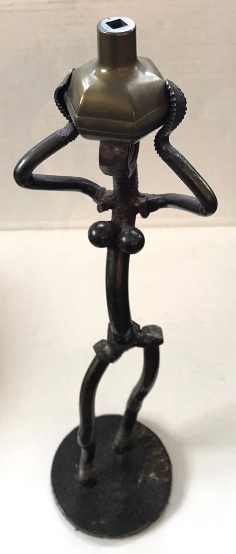 F. Russo, Nuts And Bolts Female Industrial Sculpture: Modernist female Nuts and Bolts figural sculpture signed by the artist, F. Russo. Found iron nuts and bolts. Dimension: 17.25". Condition: good condition. Provenance: private estate