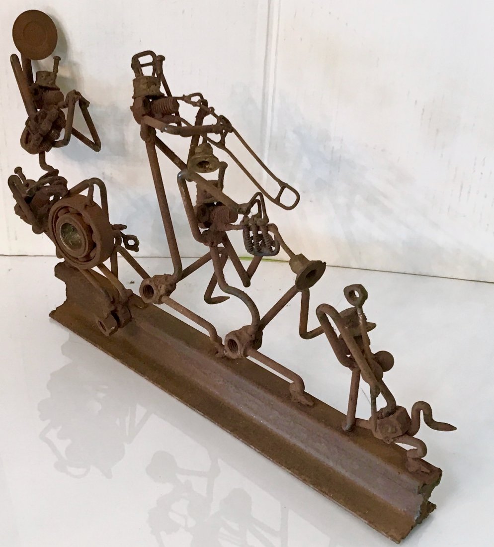 Nuts & Bolts Industrial Sculpture, Marching Band: Figural sculpture created from industrial iron nuts and bolts. Figural nuts and bolts formed to create a marching band of musicians: drummer, trombonist, trumpeter, french hornist & drum major along i