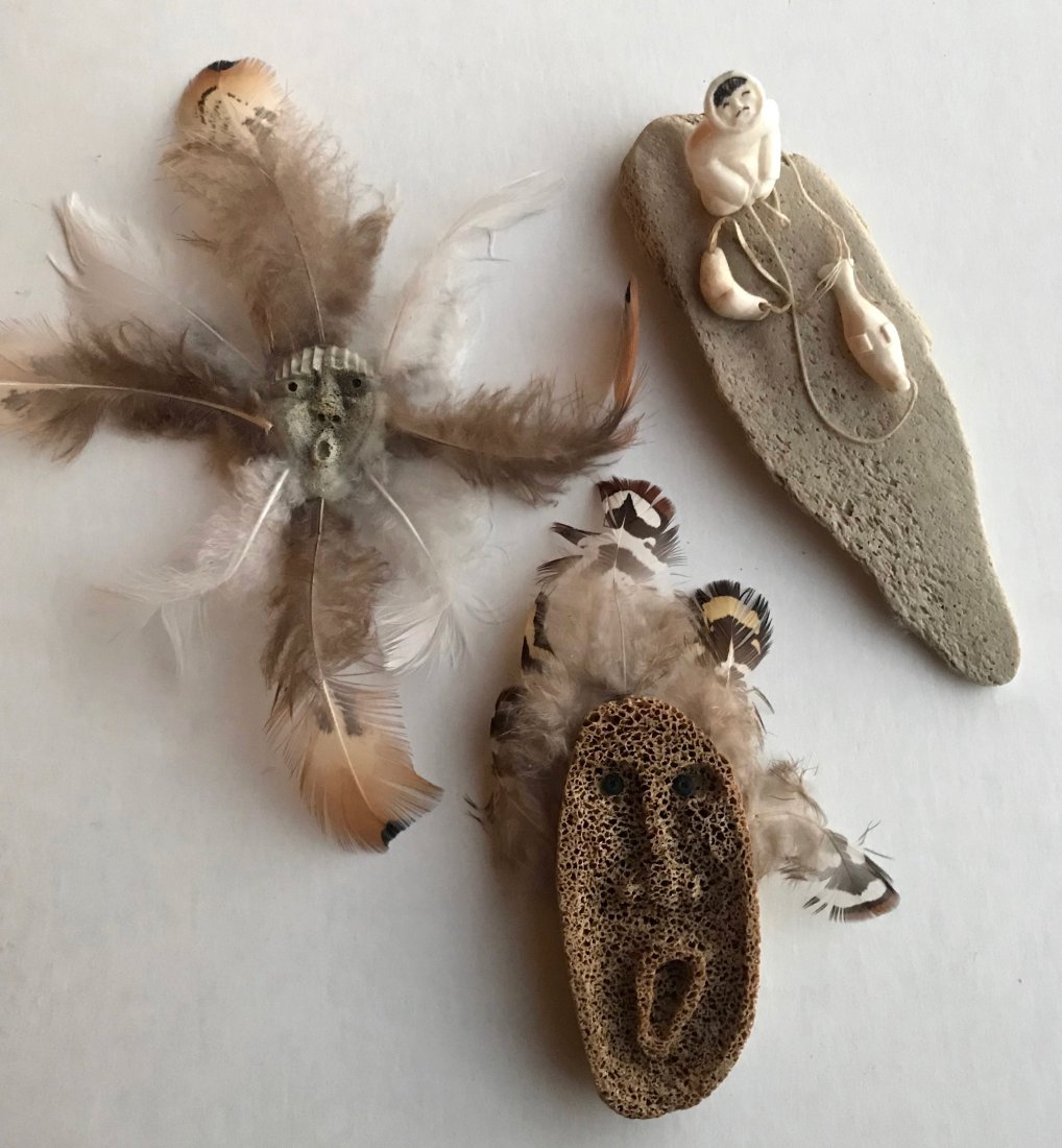 Alaskan Eskimo Carvings,Carver Signed (3): Collection of three Eskimo Inuit carvings. 1: Artist signed (view photo) Eskimo seal hunter carving. Dimension: 7"lg. x 2.6" wd. 2: Artist signed (view photo) multi feather miniature Eskimo mask. Dime