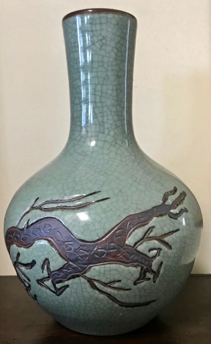 Crackle-Glaze Dragon Vase Signed: Crackleware porcelain dragon vase, signed on base . Dragon etched upon a greenish blue crackle ground. Signed on base (view photo). Dimension: 13 in hgt. Condition: good condition, no chips or repairs