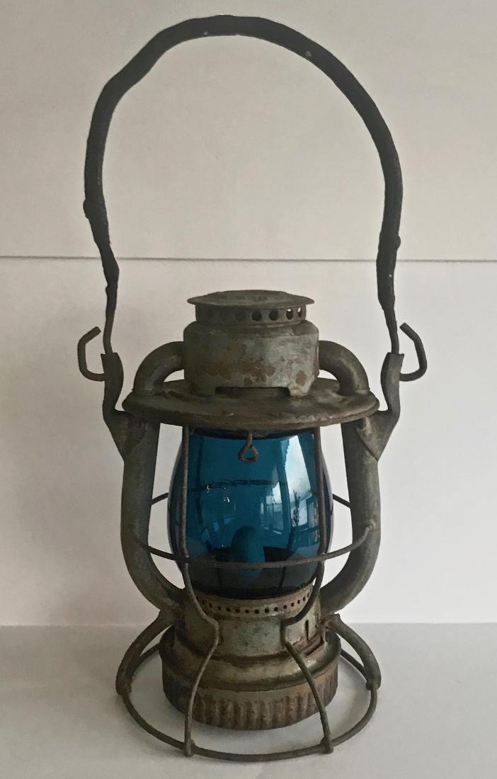 New York Dietz Vesta Cold Blast Lantern With Blue Globe: A Dietz lo-top Vesta cold blast railroad lantern with dark cobalt blue glass shade or globe. Marked DIETZ VESTA. NEW YORK U.S.A. Dimensions: 15in x 8in. Condition: good original condition, blue globe