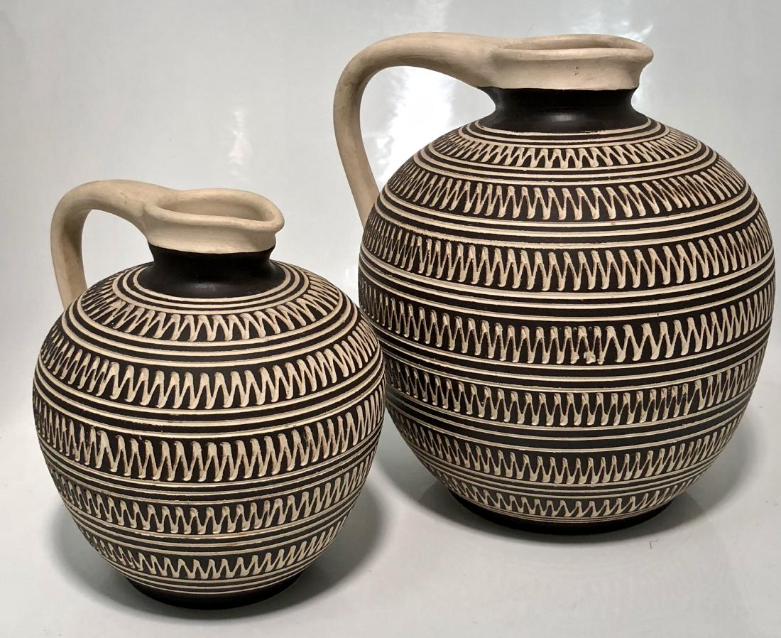 Mid-Century Raymor Studio Sgraffito Handled Urns: Original hand-made Raymor studio pottery sgraffito decorated vase / urn/ jug vessel with handles.. Pottery marked (Steuler) RAYMOR Germany. Circa 1950s. Dimensions: Large Urn: 9.6 in. hgt. x 9 in. wd;