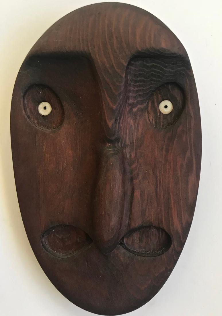 Peter Lind Jr. Northwest Coast Mask: Peter Lind Jr. (Southwestern Alaska, 20th century). Northwest Coast Hand-Carved Wood Mask, signed by the carver, Peter Lind Jr.(view photo). Dimensions: 8.25 in. x 5.25 in.. Condition: good original e