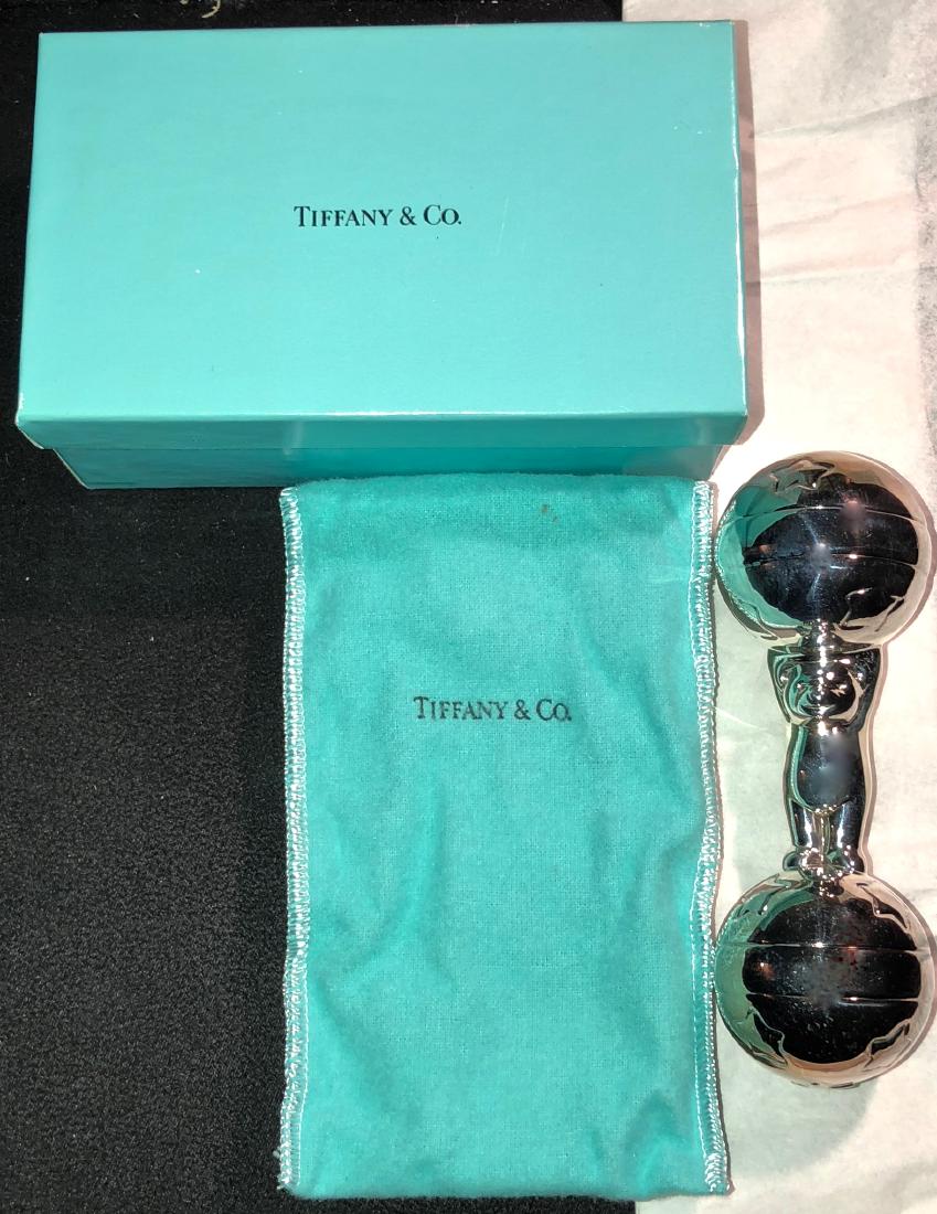 Tiffany & Co Silver Baby Bear Rattle Dumbbell W/ Box: Tiffany & Co .925 Sterling Silver Bear Star Circus Barbell Baby Rattle. Hallmarked on star on one end: T & Co 925. Dimension: Length: 5.25 in. Original Tiffany box and Tiffany felt storage bag. Condit