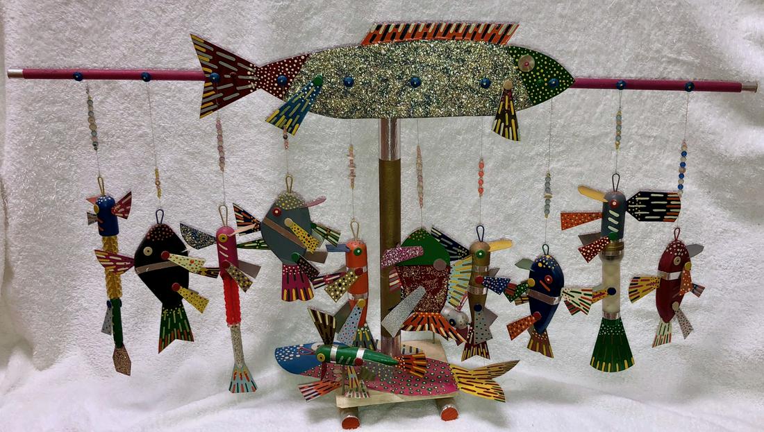 Outsider Folk Art Carving FISH & LURES I.Laycock 1970s: American outsider folk art, hand-carved and painted wood carvings of a variety of colorful fish and lures. 10 hanging fish and lures balancing on a wood pole with a large center fish. Ivan Laycock (Am