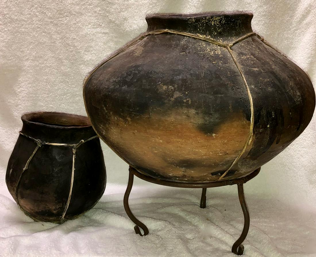 TARAHUMARA Tribal Earthenware Vessels (2): Two early 20th century Tarahumara Indian Rawhide Bound Pottery Vessel on custom iron stand. Located in Northern Mexico and the canyons of the Sierra Madre the tribe of indigenous people known as the T