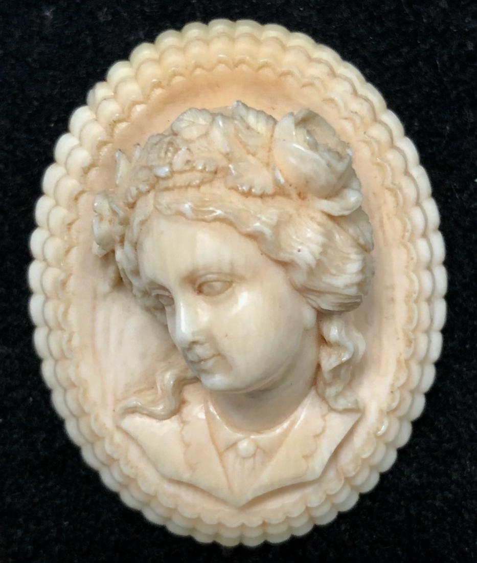 19th C. Antique Hand Carved Cameo Brooch: Exquisite antique Victorian hand carved bone cameo brooch. Classic lady carved in relief. Late 1800s. Approximate dimensions: H: 2 1/8 in., W: 1 5/8 in., D: 3/4 in. Condition: good original estate con