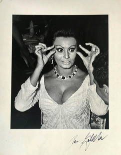 SOHIA LOREN N.Y.C. Signed RON GALELLA, 1976: Iconic actress Sophia Loren photograph signed in ink by the photographer, RON GALELLA. Image of Sophia Loren at the premiere of Doctor Zhivago, Americana Hotel, New York. Signed in ink on front by Gal